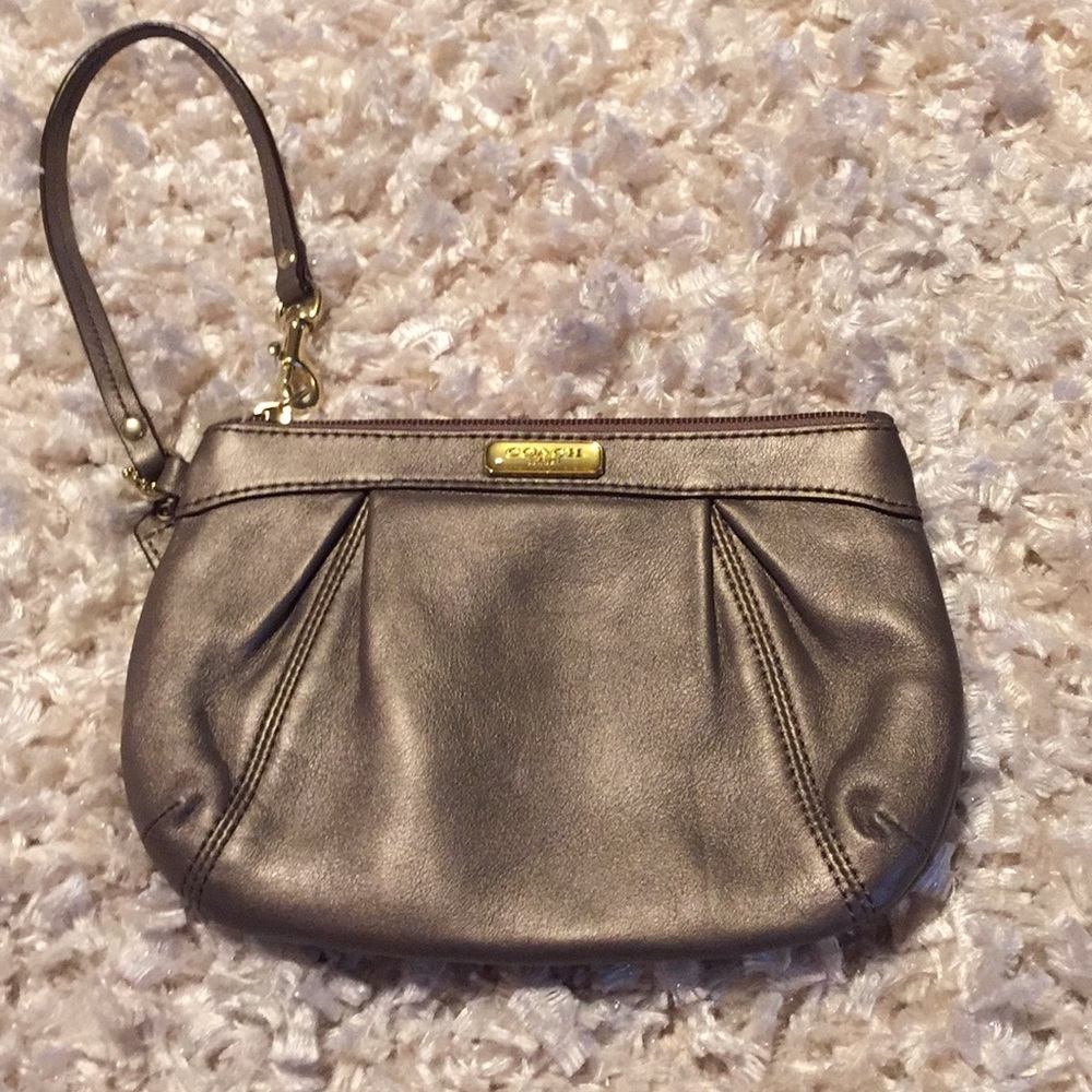 Coach Pewter W/ gold hardware wristlet.
